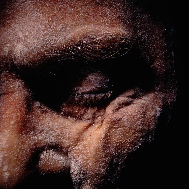 Portrait of a frozen dead human body with closed eyes
